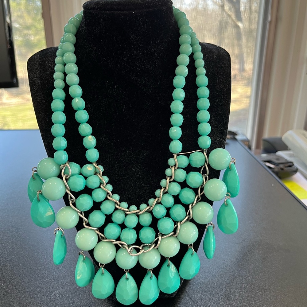 Plastic turquoise beaded necklace with adjustable hook and eye closure